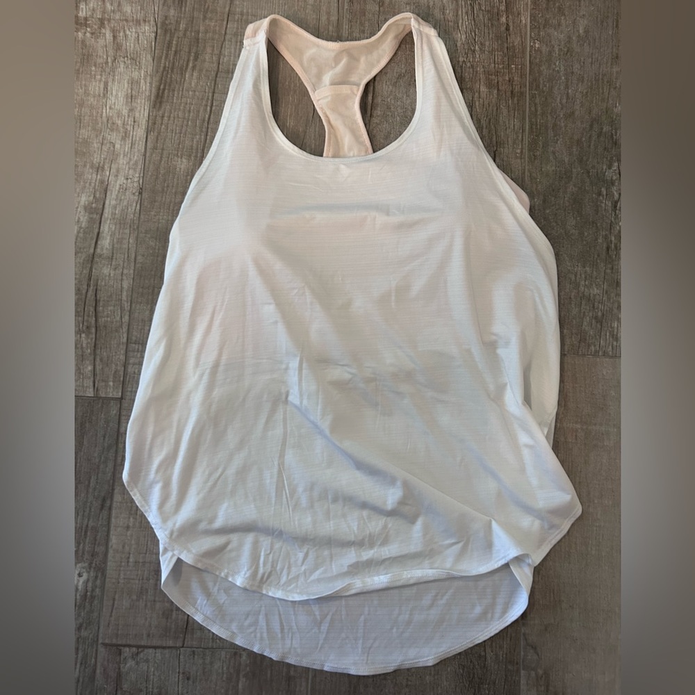 Fabletics sports bra and tank top combo. Size M and never worn.